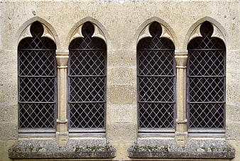 Gothic Arched Windows on Historic Stone Building Facade