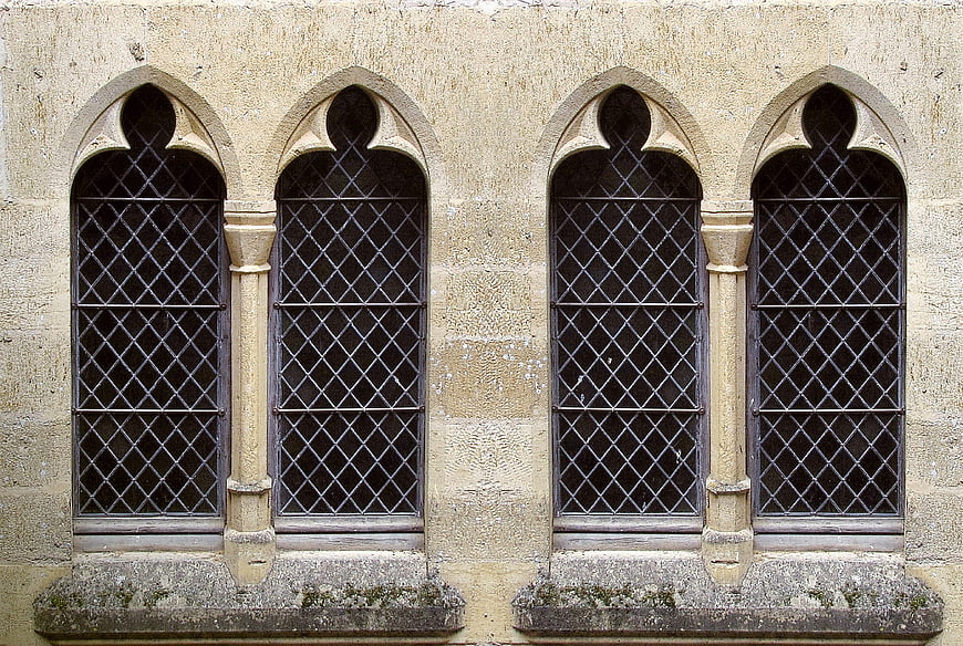 Gothic Arched Windows on Historic Stone Building Facade