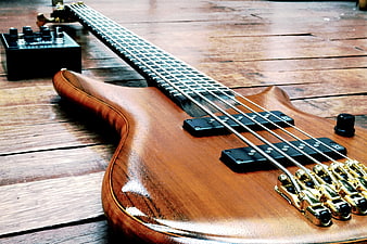 Wooden Bass Guitar on Wooden Floor with Pedal