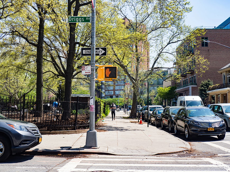 Sunny Brooklyn Street Scene with Park and Parked Cars