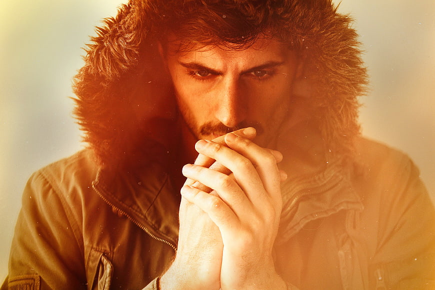 Moody Portrait of Man in Fur Hooded Jacket