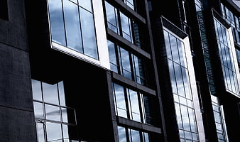 Modern Glass Building Architecture with Sky Reflections