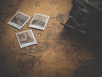 Vintage Camera and Postcards on Old World Map