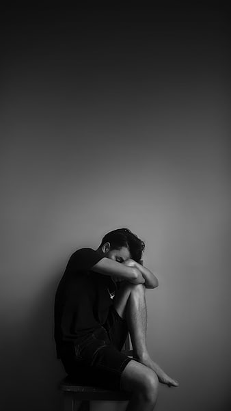 Sad Man Sitting Alone in Black and White