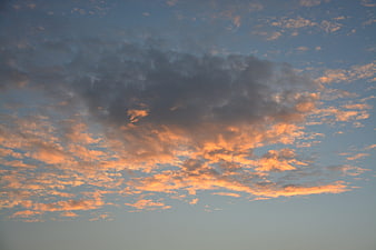 Dramatic sunset clouds with orange and blue sky