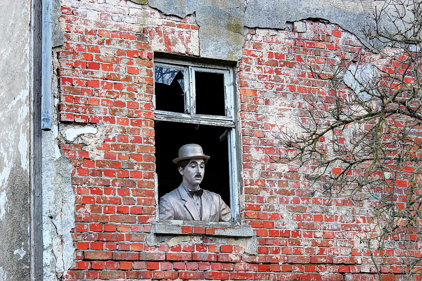 Charlie Chaplin Bust in Dilapidated Brick Window