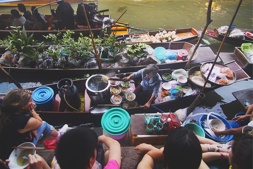 High angle view of floating market boats selling food and plants