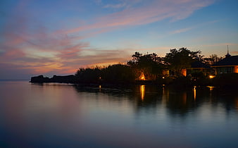 Serene Sunset Reflections on Calm Ocean Water