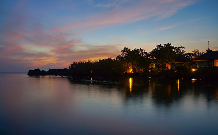 Serene Sunset Reflections on Calm Ocean Water
