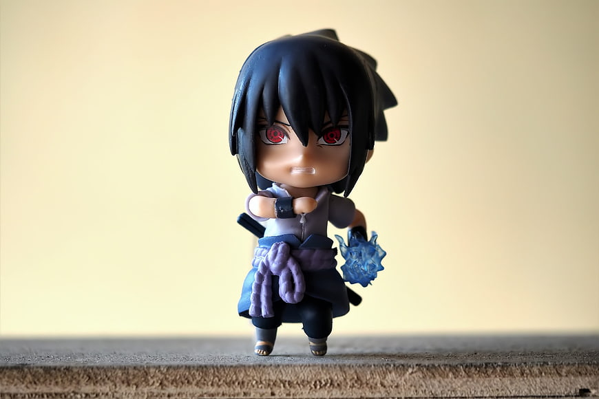 Sasuke Uchiha Nendoroid Figurine on Wooden Surface