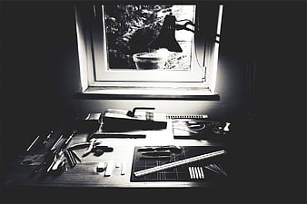 Black and White Artist Desk with Tools by Window