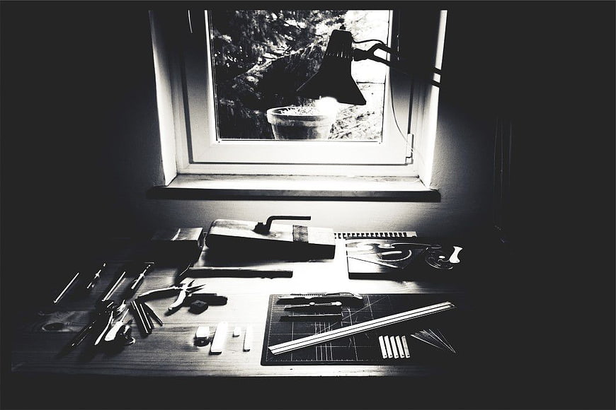 Black and White Artist Desk with Tools by Window