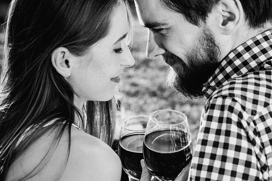 Romantic Couple Drinking Red Wine Outdoors