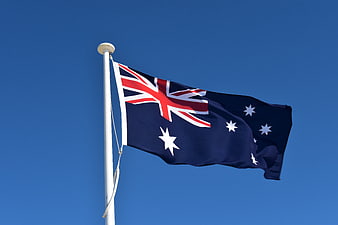 Australian National Flag Waving Against Clear Blue Sky