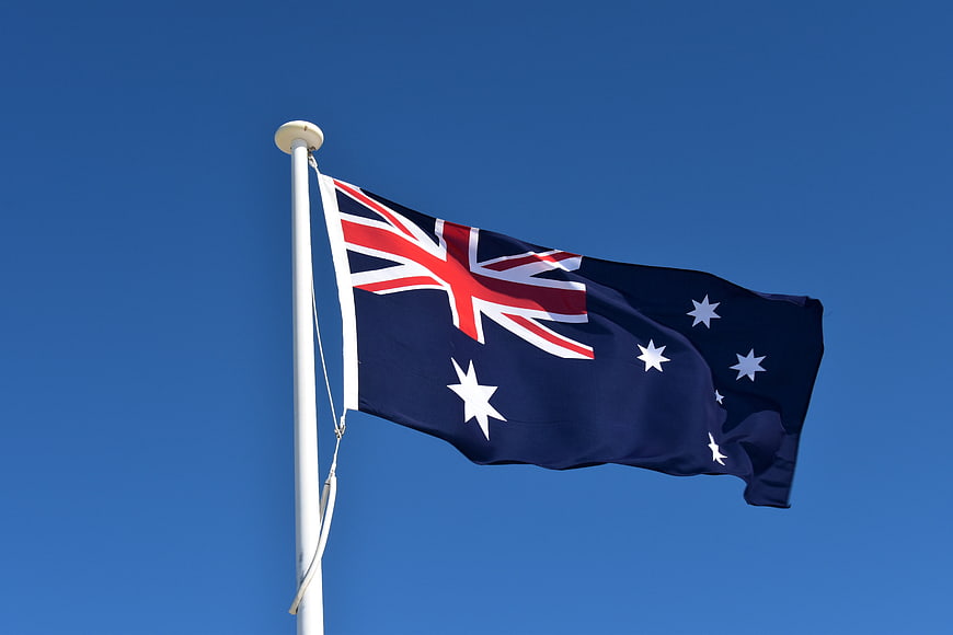 Australian National Flag Waving Against Clear Blue Sky