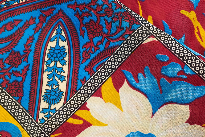 Vibrant Blue and Red Floral Textile Pattern Close-Up