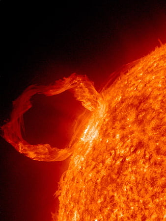 Solar flare eruption with fiery plasma loop against black space background