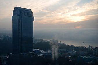 Modern Skyscraper Overlooking Foggy Bosphorus at Sunrise