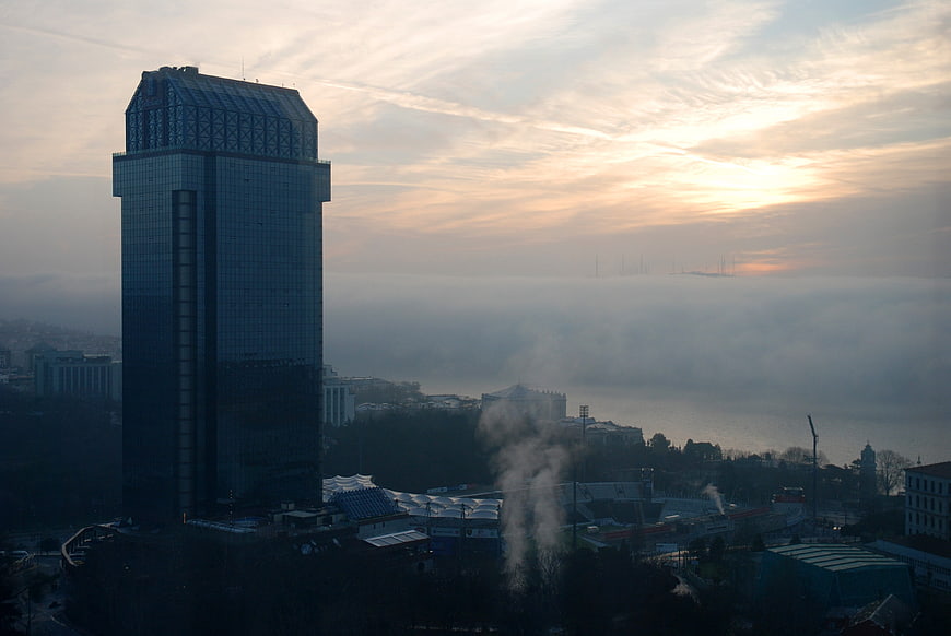 Modern Skyscraper Overlooking Foggy Bosphorus at Sunrise