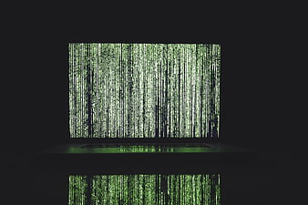 Laptop Screen Displaying Green Matrix Code Rain Effect