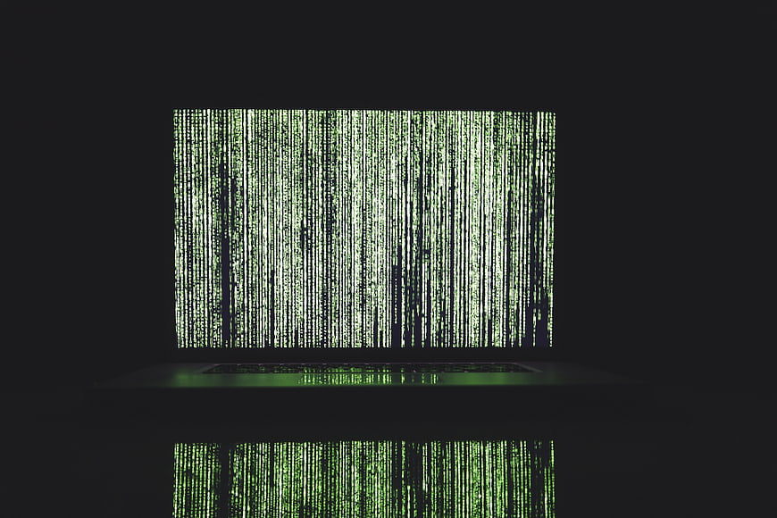 Laptop Screen Displaying Green Matrix Code Rain Effect