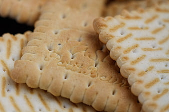 Close-up of Golden Baked Biscuits with Intricate Patterns