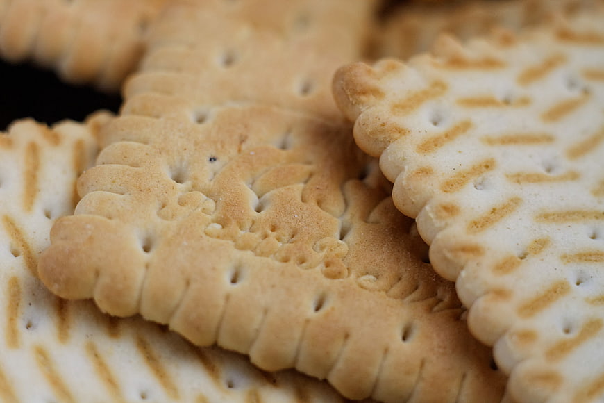 Close-up of Golden Baked Biscuits with Intricate Patterns
