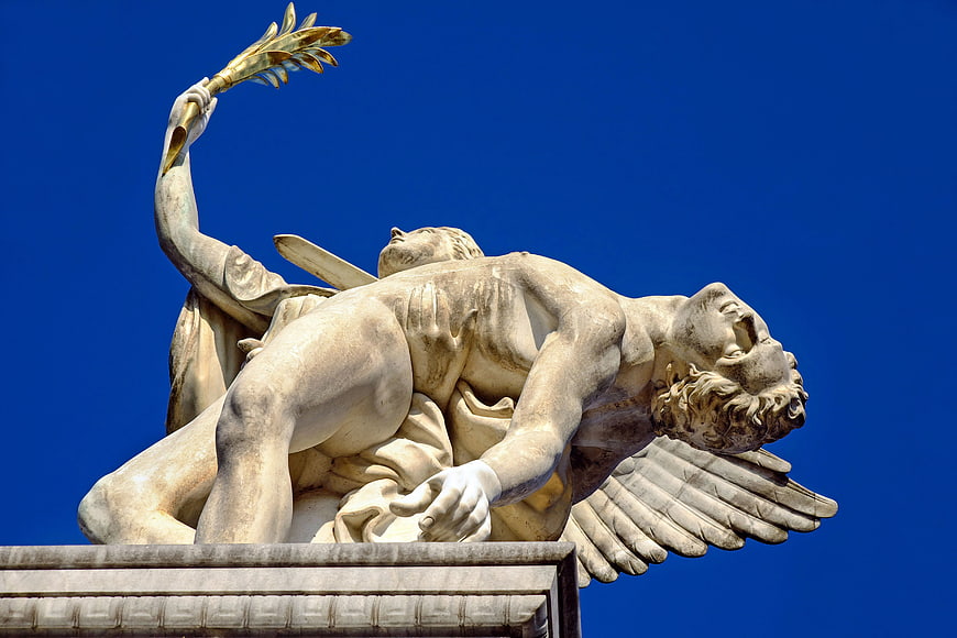 Nike and Fallen Warrior Marble Sculpture Against Blue Sky