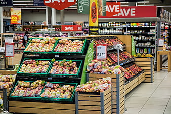Supermarket Produce Section with Apples on Sale
