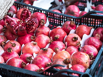 Fresh Red Pomegranates in Black Market Crate