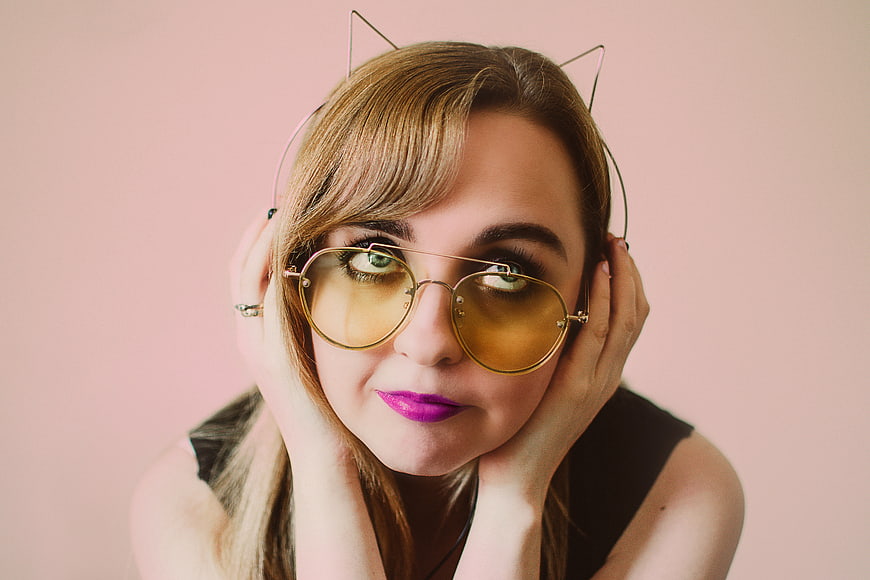 Woman with Cat Ear Headphones and Yellow Sunglasses