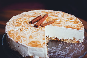 Homemade cinnamon cheesecake with powdered sugar swirls