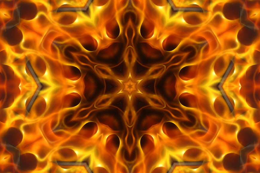 Abstract fiery kaleidoscope pattern with glowing orange and gold geometric design