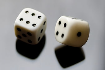 Two White Dice Showing Seven on Gray Background
