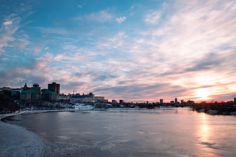 Winter Sunset Over Ottawa River and City Skyline