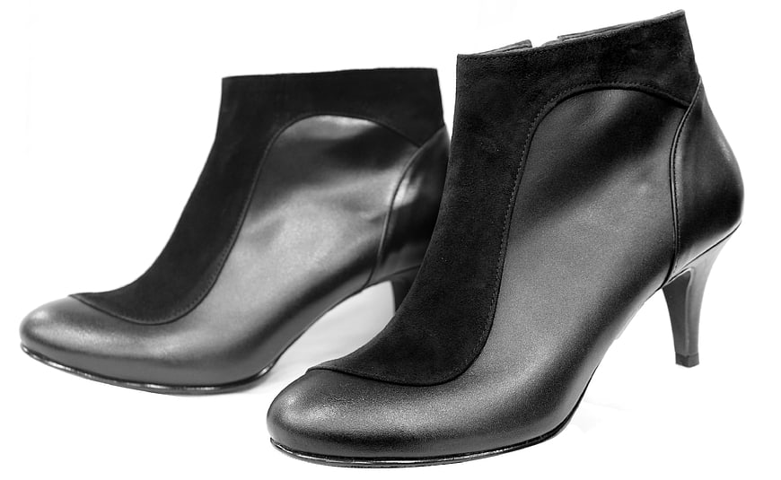 Black Leather Ankle Boots With Suede Trim On White Background