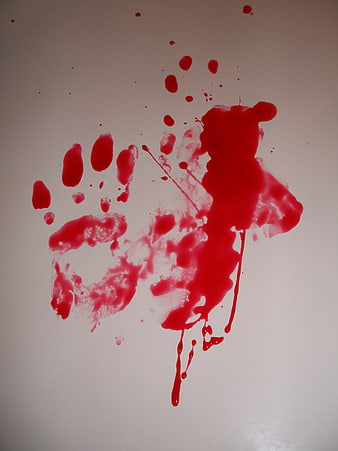 Red blood handprint and splatter on white background