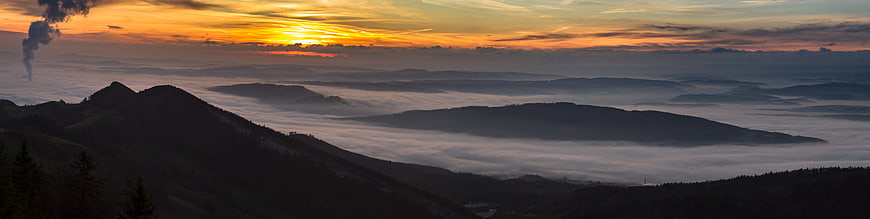 Panoramic Sunrise Over Foggy Mountain Valleys