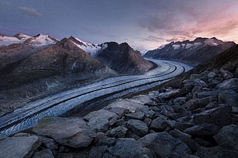 Majestic Glacier Valley at Dusk with Rocky Foreground