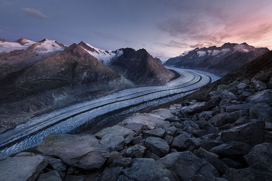 Majestic Glacier Valley at Dusk with Rocky Foreground