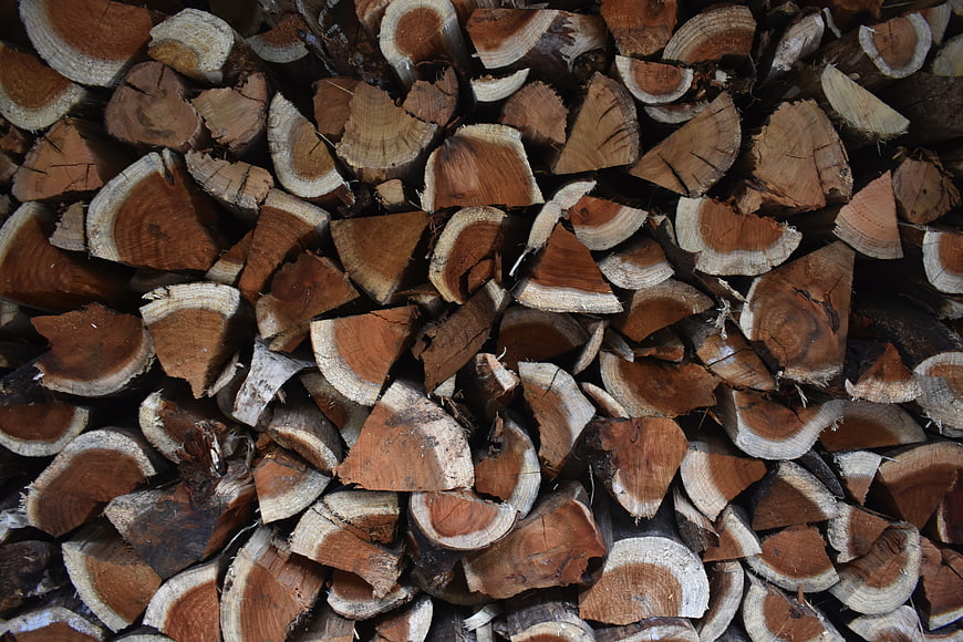 Close-up texture of stacked firewood logs