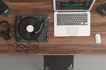 Top View of Vinyl Turntable and Laptop on Wooden Desk