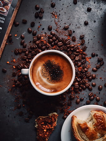 Top View of Cappuccino with Pastry and Coffee Beans