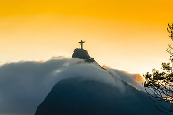 Christ the Redeemer Silhouette in Clouds at Sunset