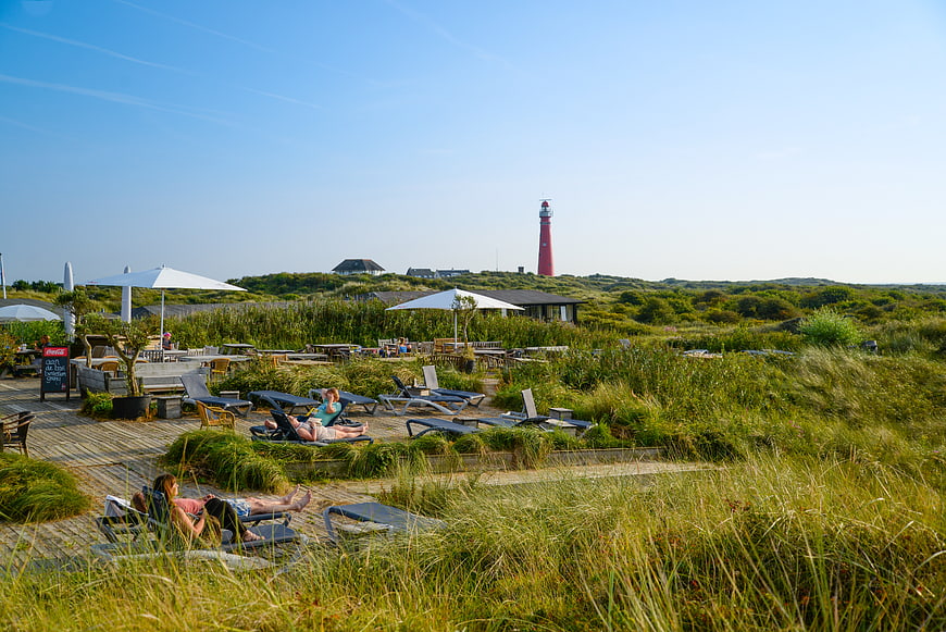 Lounge chairs and lighthouse on Schiermonnikoog dunes