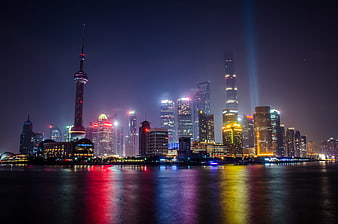 Shanghai Skyline Night View with Oriental Pearl Tower and Water Reflections