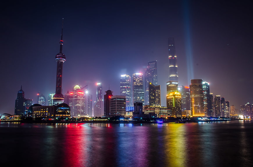 Shanghai Skyline Night View with Oriental Pearl Tower and Water Reflections