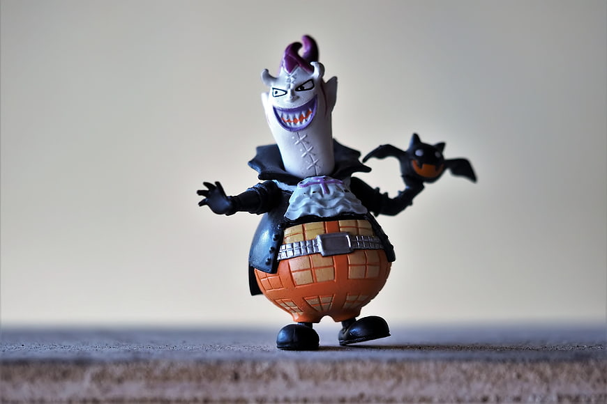 One Piece Kuro Vampire Figurine Toy On Textured Surface
