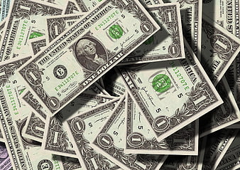 Scattered US One Dollar Bills with Dramatic Shadows