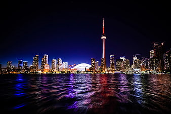 Toronto Skyline at Night with CN Tower and Water Reflections